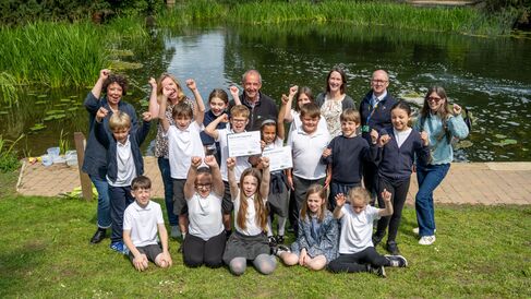Children & Staff celebrating successful release of the eels into the River Ouse