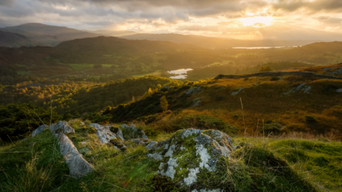 Photo from high perspective of the lake district at sunset